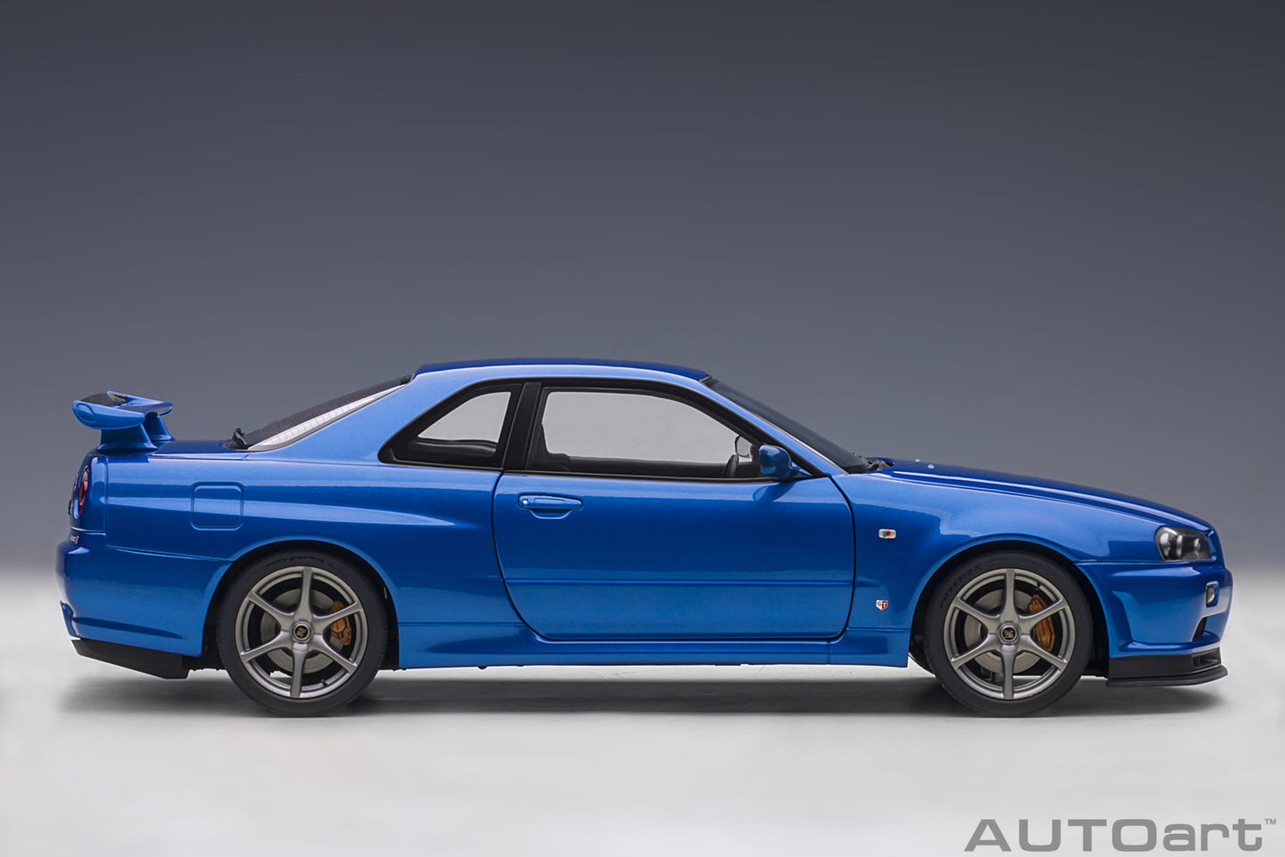 Nissan Skyline GT‑R (R34) V‑Spec II – Bayside Blue – AUTOart