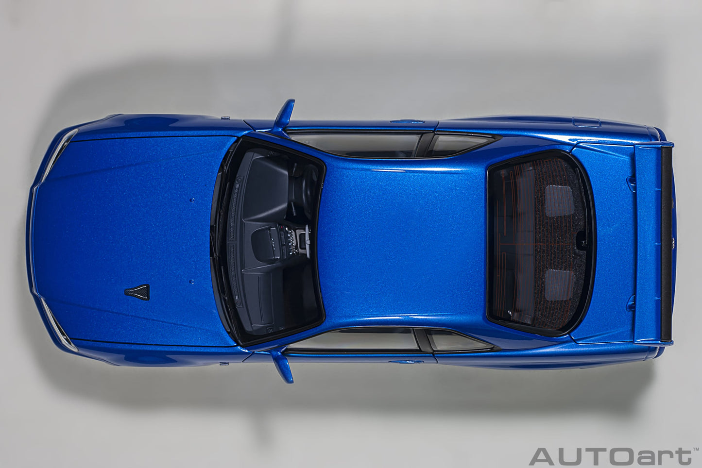 Nissan Skyline GT‑R (R34) V‑Spec II – Bayside Blue – AUTOart