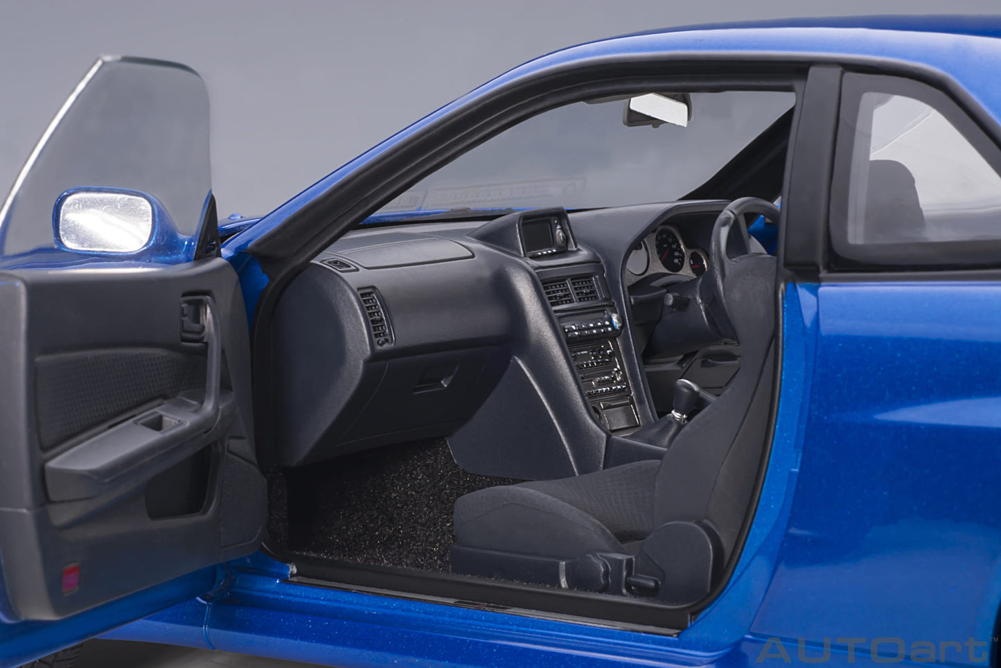 Nissan Skyline GT‑R (R34) V‑Spec II – Bayside Blue – AUTOart