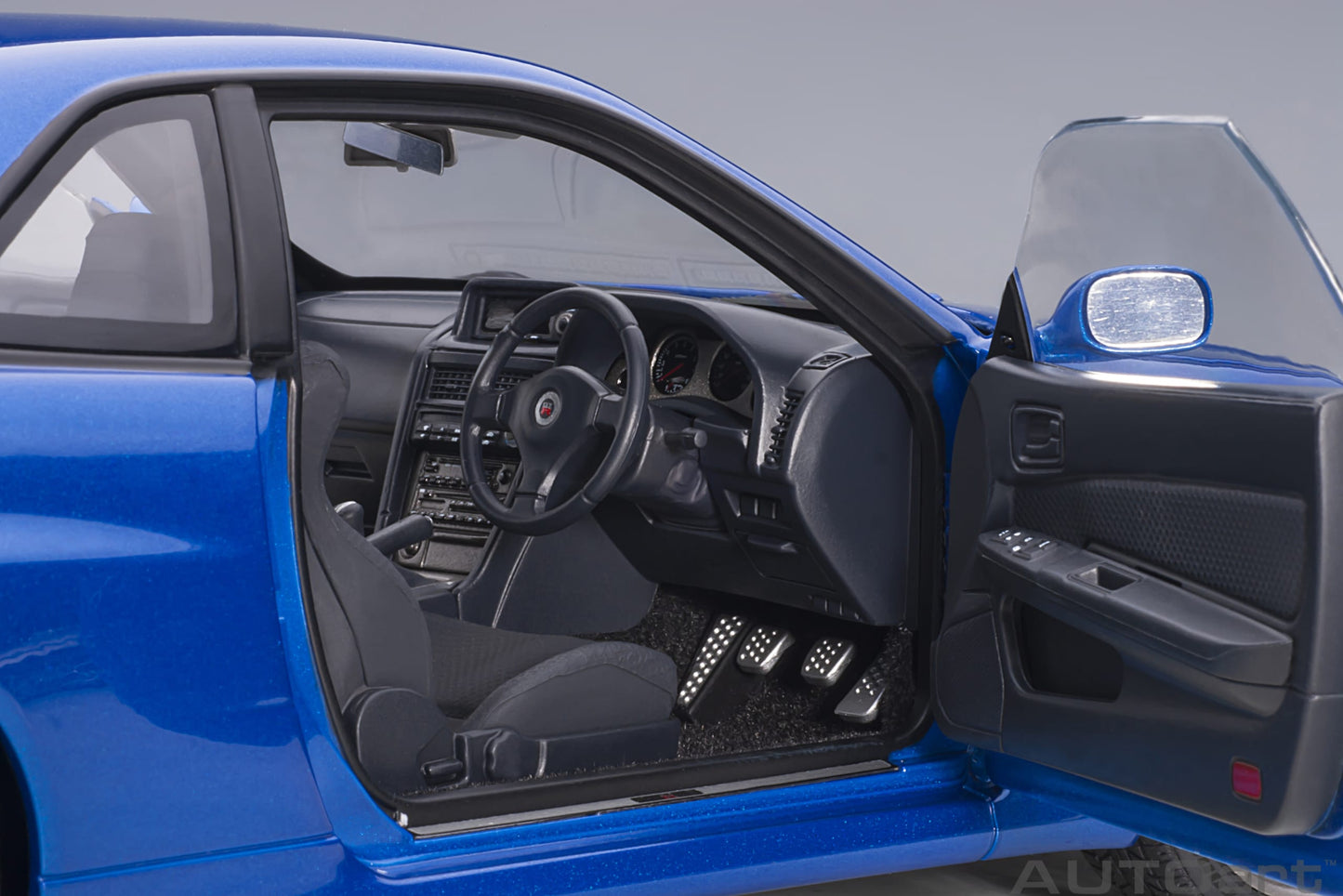 Nissan Skyline GT‑R (R34) V‑Spec II – Bayside Blue – AUTOart