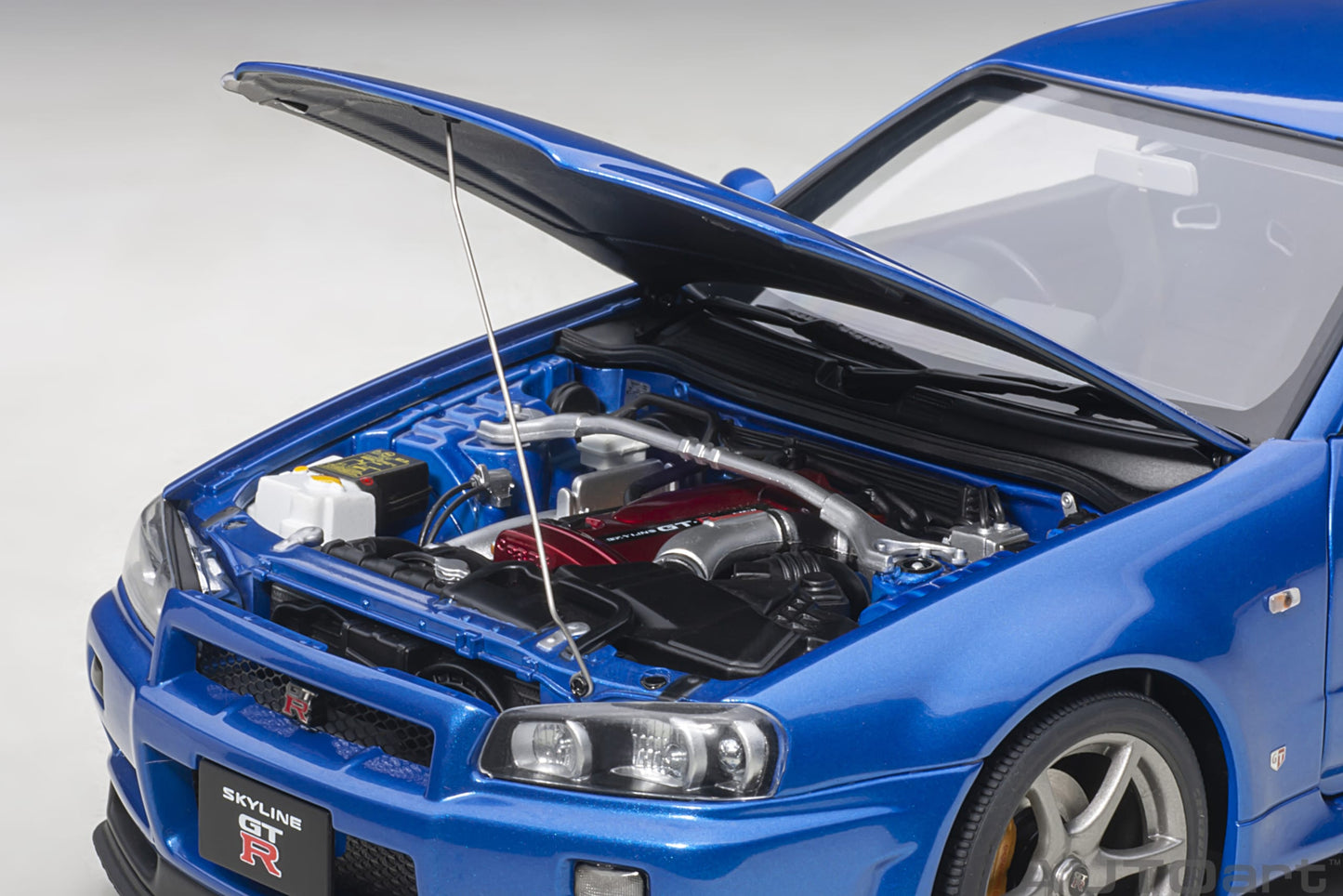 Nissan Skyline GT‑R (R34) V‑Spec II – Bayside Blue – AUTOart