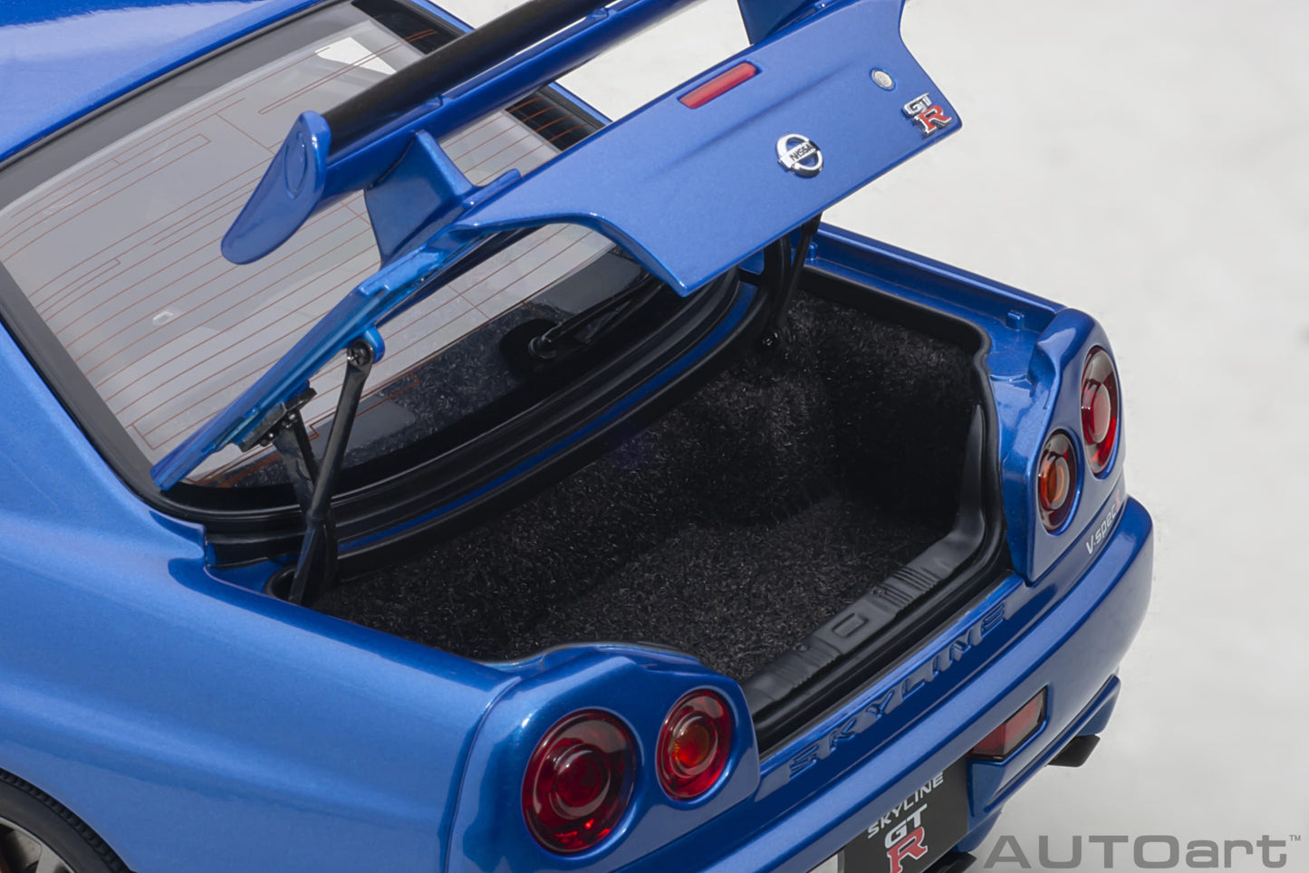 Nissan Skyline GT‑R (R34) V‑Spec II – Bayside Blue – AUTOart