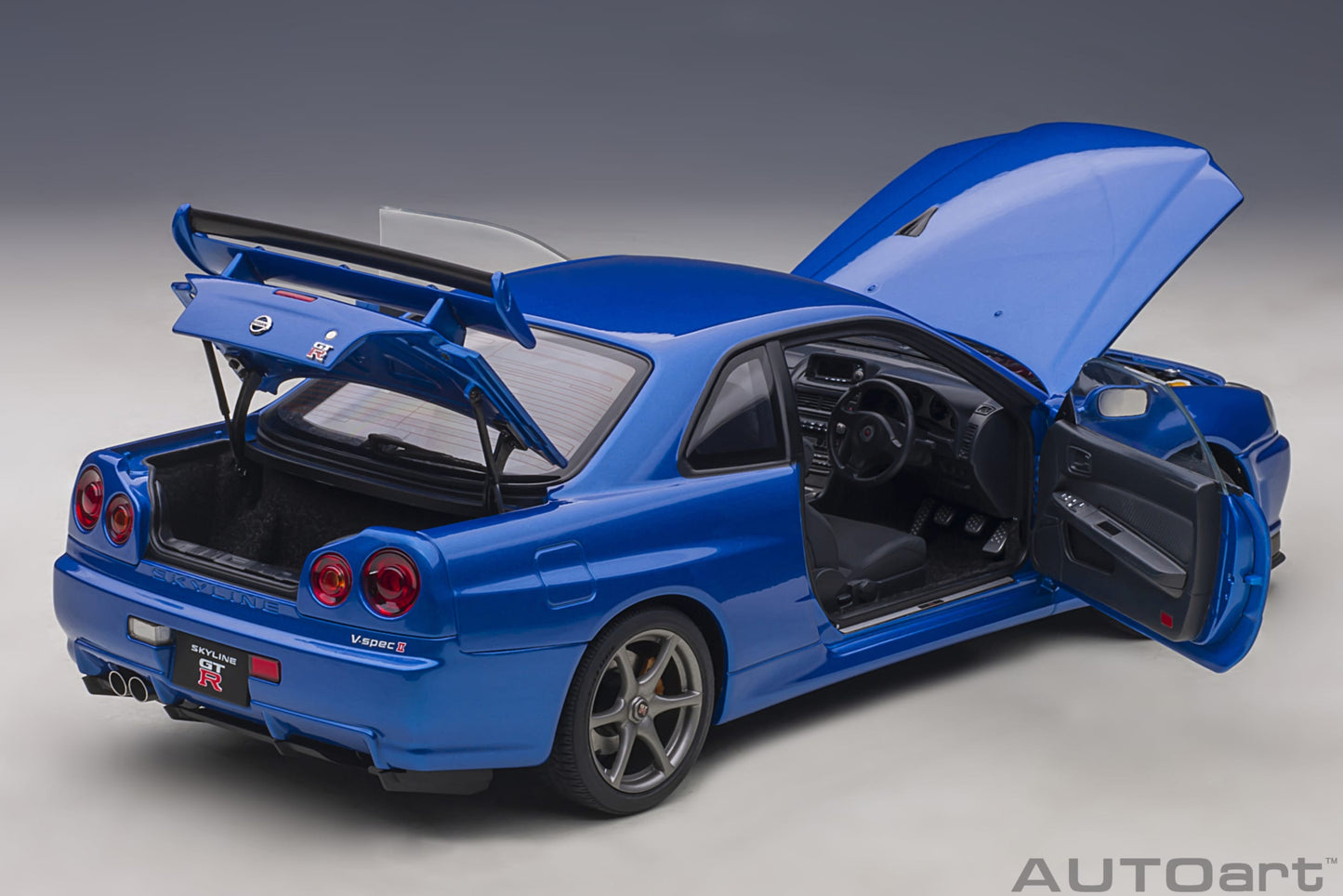 Nissan Skyline GT‑R (R34) V‑Spec II – Bayside Blue – AUTOart