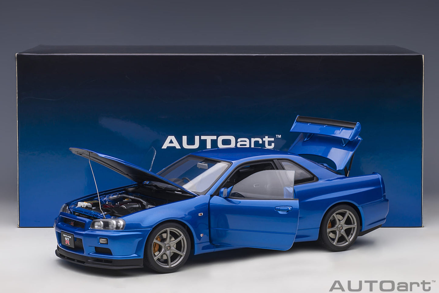 Nissan Skyline GT‑R (R34) V‑Spec II – Bayside Blue – AUTOart