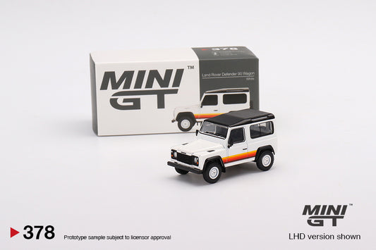 Land Rover Defender 90 Wagon – 1:64 – White s prugama i crnim krovom – Mini GT